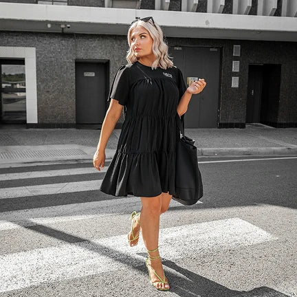 woman crossing the street wearing savvy industry clothing