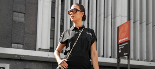 woman wearing savvy industrial clothing with sunglasses
