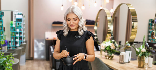 woman mixing hair solutions